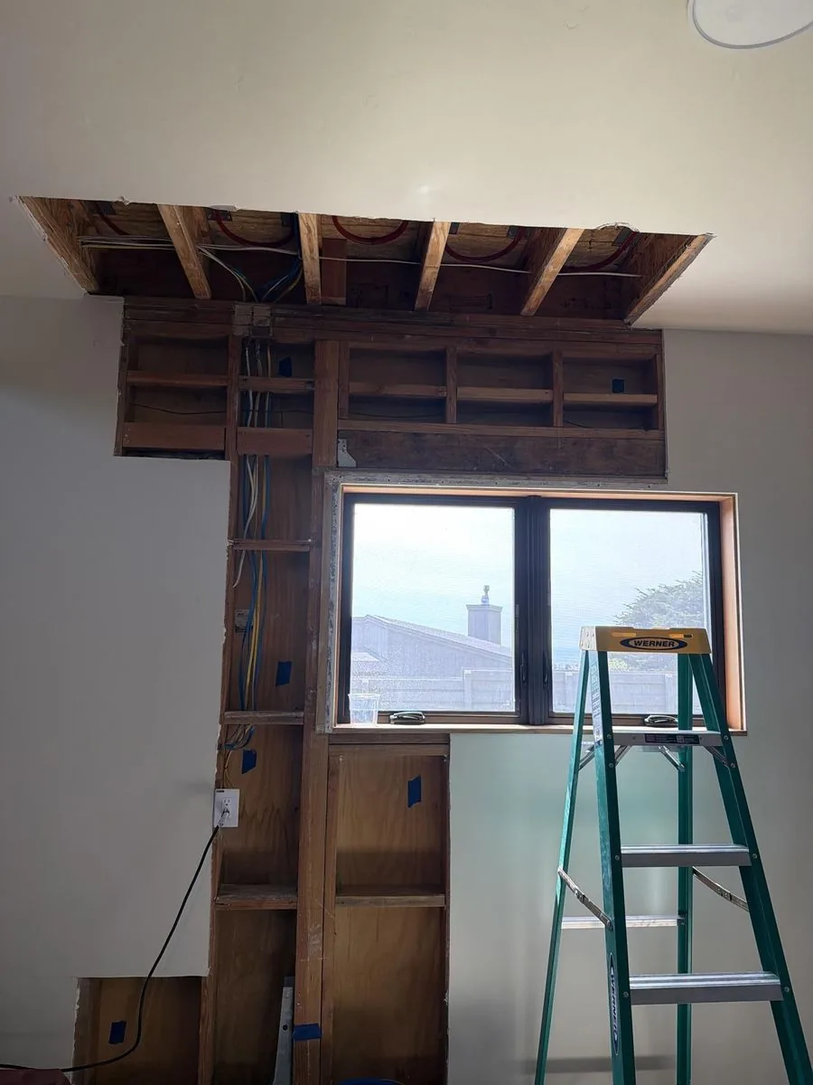 Ceiling and wall opened for structural drying after water damage at a Sea Ranch home